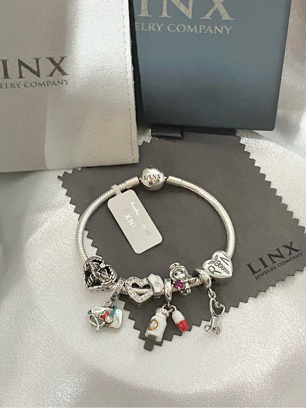 Linx Sterling Silver Snake Chain Bracelet with Registered Nurse Themed Charms
